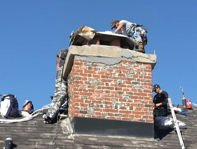 Hamden Chimney Sweep installing a custom chimney crown in Hamden, CT