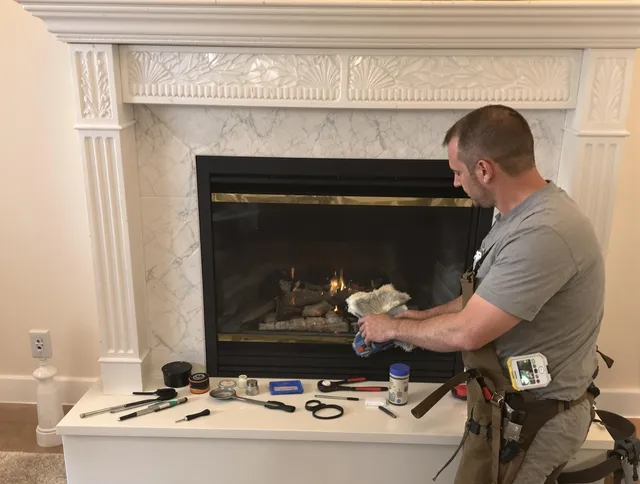 Hamden Chimney Sweep performing fireplace maintenance in Hamden, CT