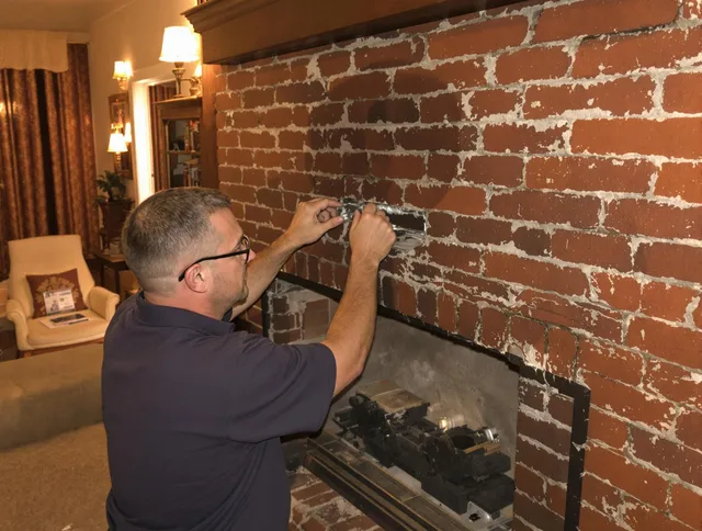 Hamden Chimney Sweep expert fixing a fireplace in Hamden, CT